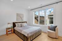 The fifth bedroom features its own private bath with a walk-in shower