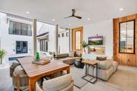 The screened-in porch features a double-sided gas fireplace and remote-controlled screens—offering year-round comfort with just the touch of a button.