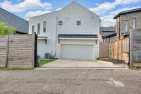 A gated entrance leads to the garage, combining everyday convenience with discreet privacy and peace of mind.
