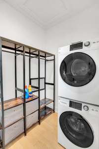 One of three laundry spaces, the bonus suite’s washer/dryer setup adds smart functionality for visitors, long-term guests, or work-from-home life.