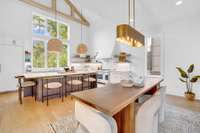 This kitchen is the true heart of the home—featuring vaulted ceilings, Thermador appliances, a Bertazzoni Italian gas range, a spacious island with designer pendants, a walk-in pantry, and custom cabinetry designed for maximum function.