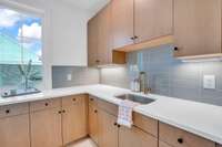 A built-in sink adds everyday convenience—ideal for quick rinses, hand-washing, or small cleanups.