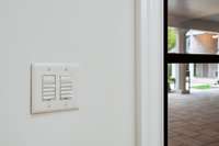 Custom Smart Switches throughout home make lighting this residence a breeze.
