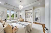 Bedroom Suite No. 4 is super elegant with its inset celling, chandelier, recessed lighting and walnut-stained hickory wood floors. The open door is a peek inside the fabulous rec room space.