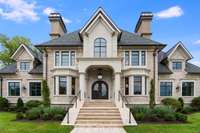 A stunning front stone & real stucco facade. The flickering gas lanterns adorning the front of this beautiful residence are just a hint of the many special details to come in this property!