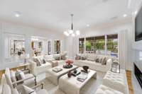 The wide wall of custom windows bring in lots of natural light.