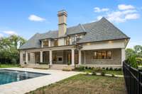 This space is fully enclosed with a handsome black fence and gating system.