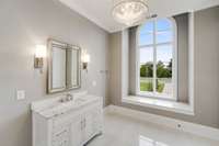 Bedroom Suite No. 4's private bath features this beautiful marble vanity and arched window overlooking the front lawn.