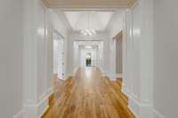 The 10' Wide Center Hall is a stunner and opens to all upper level rooms. It runs the full length of the upper level and features three chandeliers with a high-pitch ceiling in the middle. A large hall closet is "elevator ready" if buyer desires.
