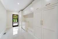 Family and friends entry + drop zone with lots of space to tuck things away. Look at all the storage options!