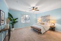 Spacious primary bedroom with window to the backyard