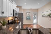 Kitchen has door to patio