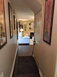 Check out the downstairs hallway with bamboo flooring. Go thru this door on the right for a pleasant surprise. Watch your step!