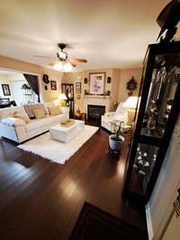 Entering thru this welcoming door off massive front porch to your new home will be a delight!  A Warming gas log fireplace and gleaming bamboo floors will delight as you settle in for some well deserved downtime!