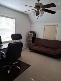 Note storage behind futon.
