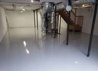 Beautiful shiny epoxy flooring in entire basement. Envisioning a pool table or maybe a third car!
