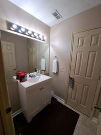 Hall bath on main level - door to combo tub/shower & toilet.