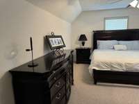 Upstairs bedroom has lots of room & has many uses: teen room, in-law suite, additional tv area, walk-in closet and lots more!