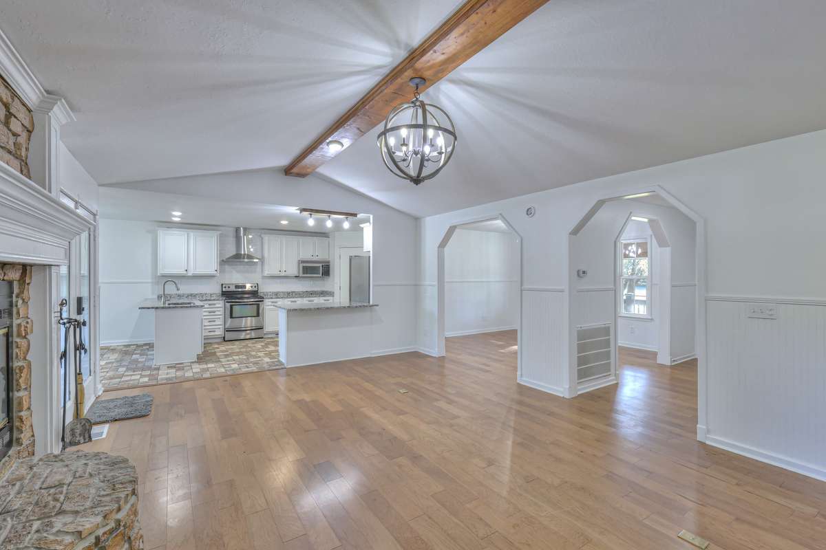 Family room is open to the kitchen and the formal dining room as you come in the front door.