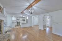 Family room is open to the kitchen and the formal dining room as you come in the front door.