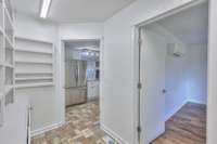 Walk-in pantry/laundry room with entrance to the office behind the kitchen