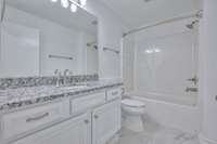 Full bath with granite countertop