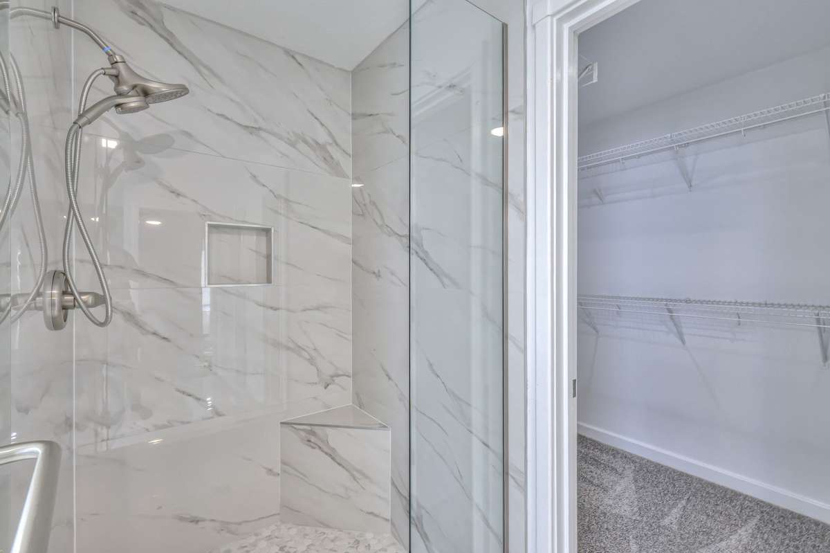 Tile shower with frameless glass door