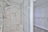 Tile shower with frameless glass door