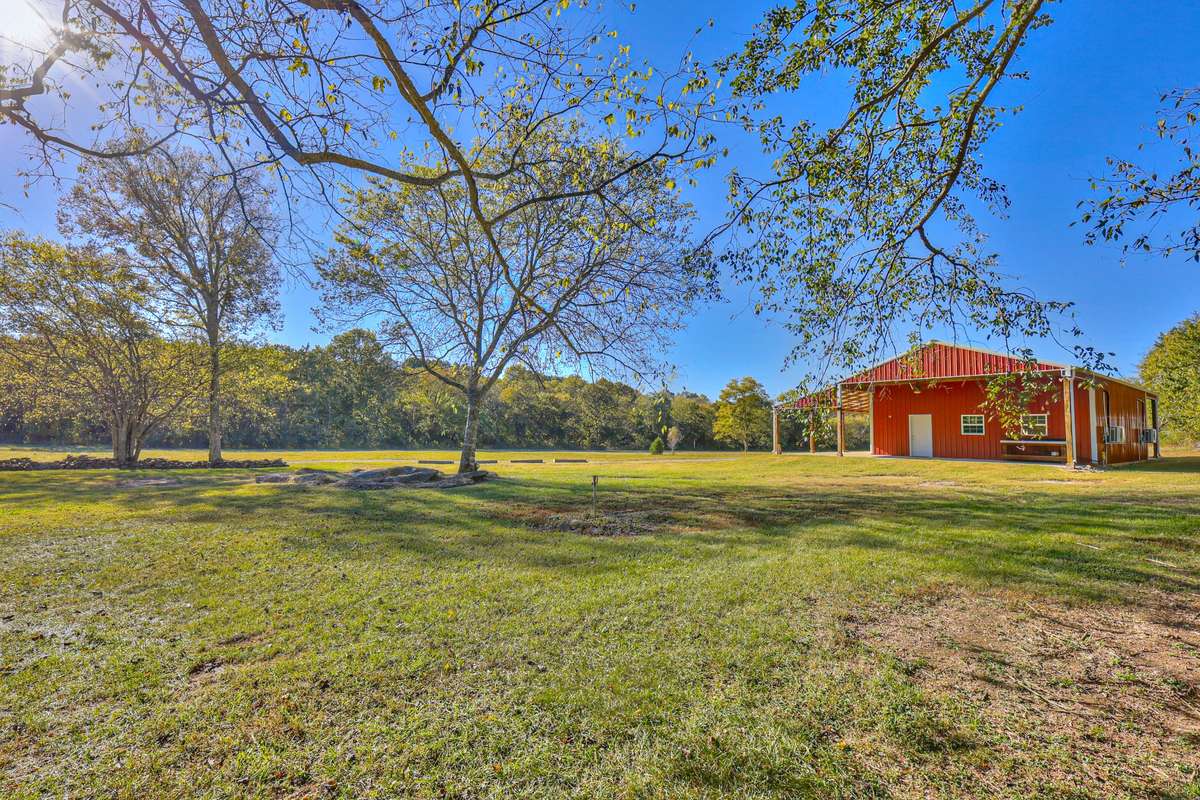Looking towards the 30'x40' metal barn from the back side of the house
