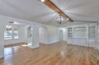 View of the family room and formal dining room from the kitchen