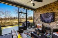 Screened porch with view of the golf course.