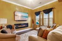 The master bedroom is large with a sitting area with a fireplace.