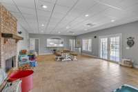 In Law Quarters (Basement Level) Living Room Area w/ Fireplace & Tile Floors - Pardon our mess, we're moving!