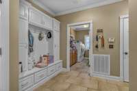 Built In Mud Bench w/ Storage Cabinets Outside of Laundry Room & Garage Areas