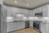 In Law Quarters (Basement Level) Full Kitchen w/ Granite Countertops, Tile Backsplash & SS Appliances