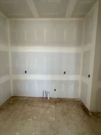 Dining Room wet bar with custom cabinetry, tile backsplash, and an undercounted wine refrigerator.