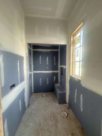 Main Level Guest Bath with lots of natural light and featuring oversized shower