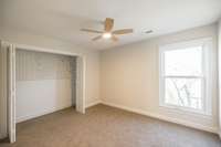 Bedroom #2 with large window and ceiling fan