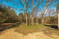 Well over an acre of mixed land with cleared and wooded space.