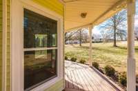 The extensive front porch wraps around the polygon exterior.