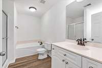 Welcome to your master bathroom, featuring a luxurious jacuzzi garden tub for the ultimate relaxation experience.