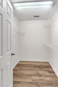 Spacious master closet with ample storage, perfect for organizing your wardrobe in style.