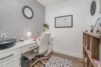 This office features generous space and built-in organizational solutions that seamlessly integrate throughout the condo.