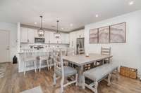 Hardwood flooring extends through the living, dining, and kitchen spaces adding to the warmth of the space.