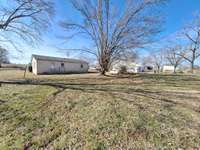 Very large beautiful flat front and backyard with a nice size storage building . Opportunities to own two homes . View MLS#