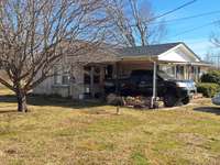Some recent updates , Investment opportunity or make it your own. Over 1000 sqft , Bay window for natural light in the living room area  large  front and back yard with a nice storage building, Offers welcome . Sold AS-IS .Call listing Broker