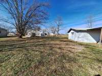 MLS# 2784537 $159,900 Currently rented month to month  $900.00 Beautiful area, flat land, Convenient, peaceful country setting. storage buildings . Homes sold separately. 2 income producing  homes, side by side. Call before they are gone!
