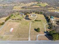 Privacy galore. Home is parceled into 3 lots if you wanted to subdivide an acre on the right and an acre on the left of the home.