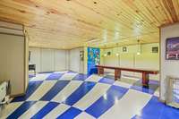 Fun game room. Shuffleboard remains.