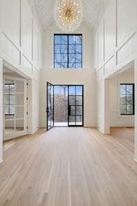 Gorgeous new white oak hardwood flooring throughout (Bona seal system/raw matte finish).  No carpet.  Spectacular two story foyer is flanked by Study on one side and Formal Dining on the other.